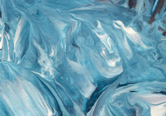 A swirling night sky with vibrant blues and whites inspired by Van Gogh's Starry Night.