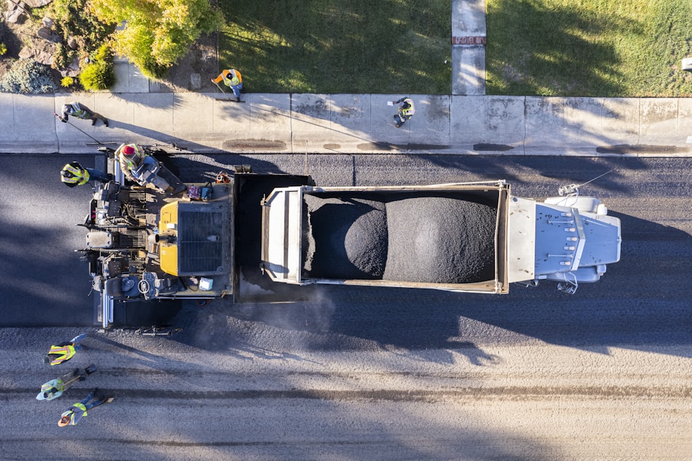 a dump truck with a load of dirt in the back