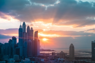 A city skyline at sunset highlighting properties with high market potential.