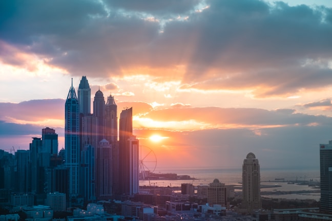A vibrant city skyline at sunset, showcasing a popular travel destination.