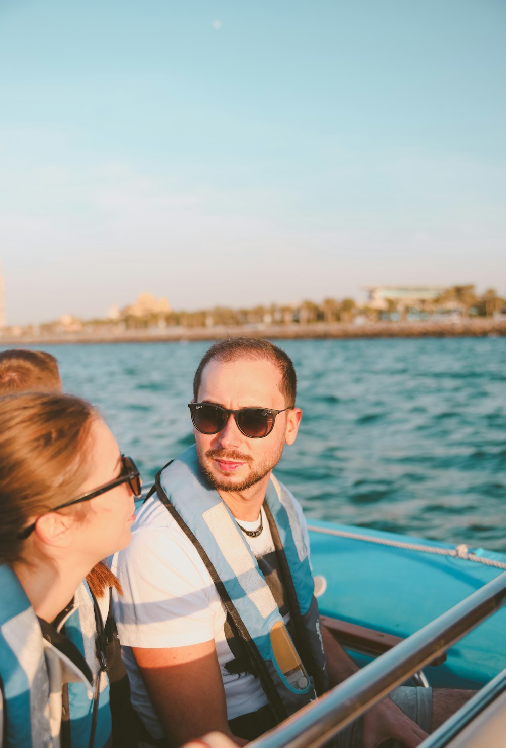 a man and a woman on a boat in the water