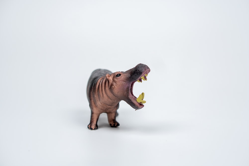 a toy hippopotamus with its mouth open