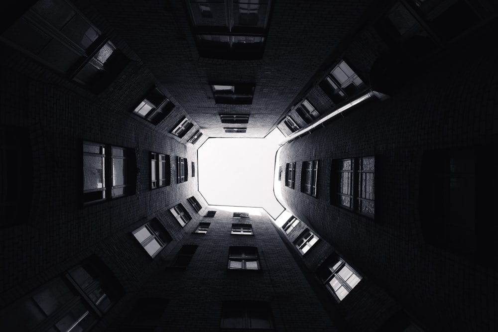 a dark room with windows and a skylight