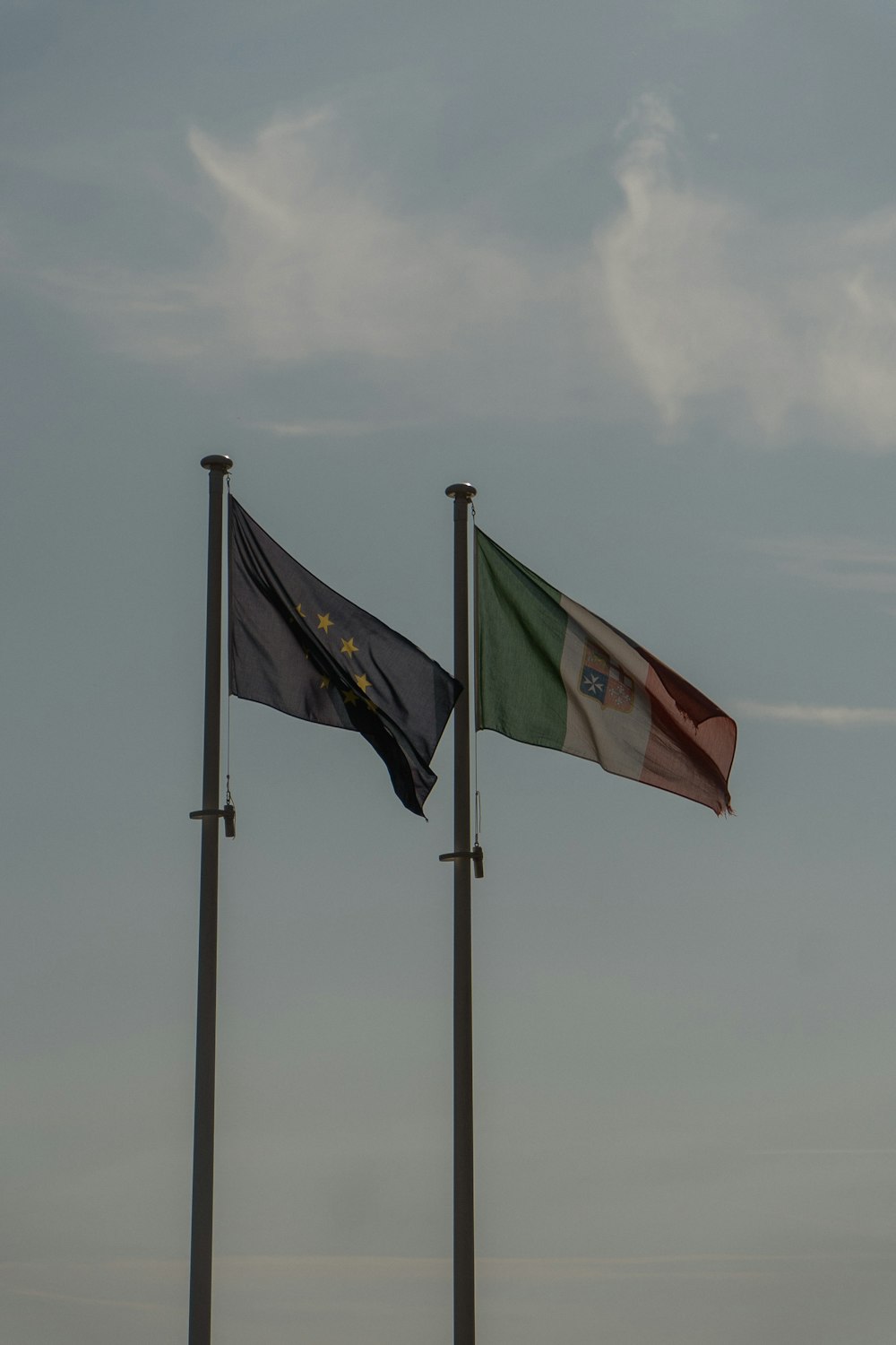 a couple of flags that are next to each other