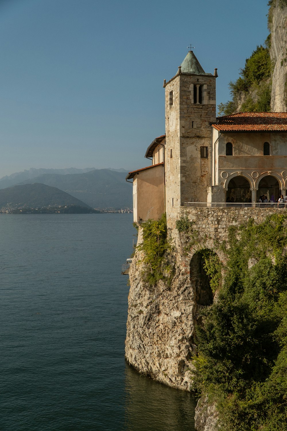 a building on a cliff overlooking a body of water