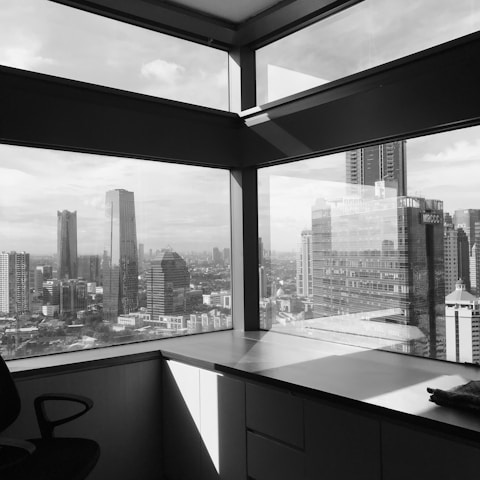 A serene office environment with a view of the city skyline.