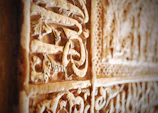 Close-up of intricate stone carvings on the facade of a centuries-old château.