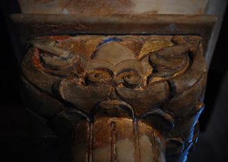 Ornate decorative pier cap with intricate patterns.