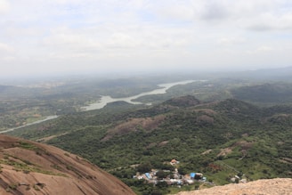 A panoramic view of the River Cess County landscape with mining operations nestled among lush greenery.