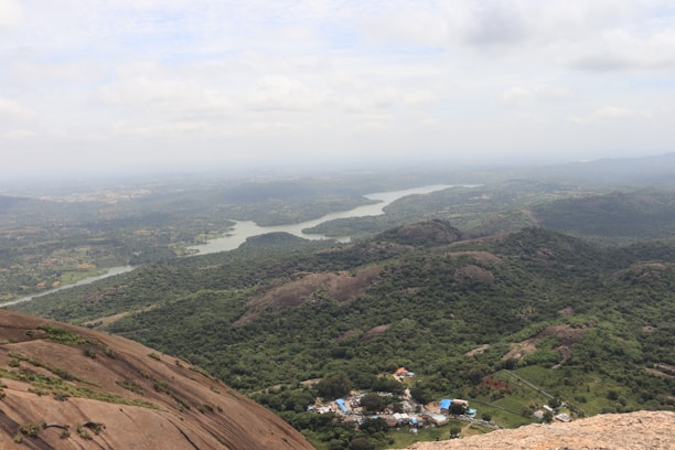 A panoramic view of the River Cess County landscape with mining operations nestled among lush greenery.
