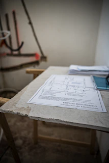 Technical drawings and fire safety plans spread out on a table