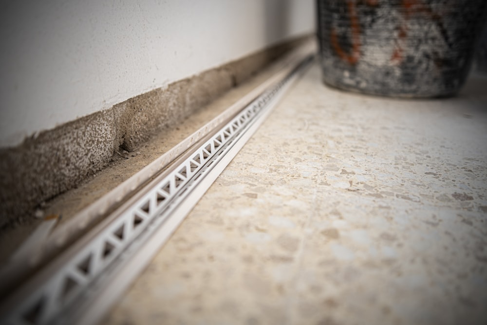 a close up of a metal rail on a wall