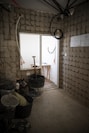 a room with a brick wall and a window