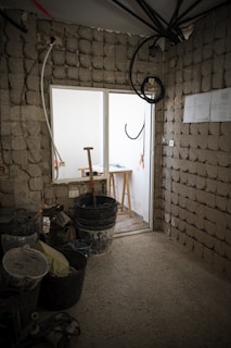 a room with a brick wall and a window