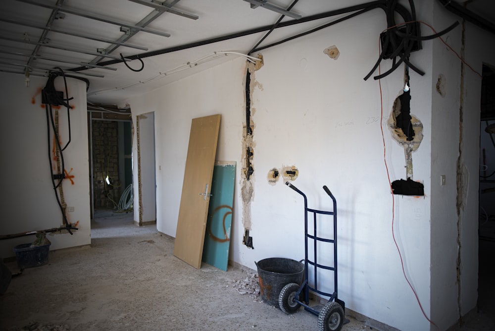 a room with a ladder and a door in it