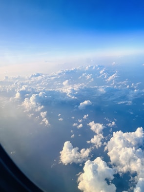 A scenic view of clouds from an airplane window.