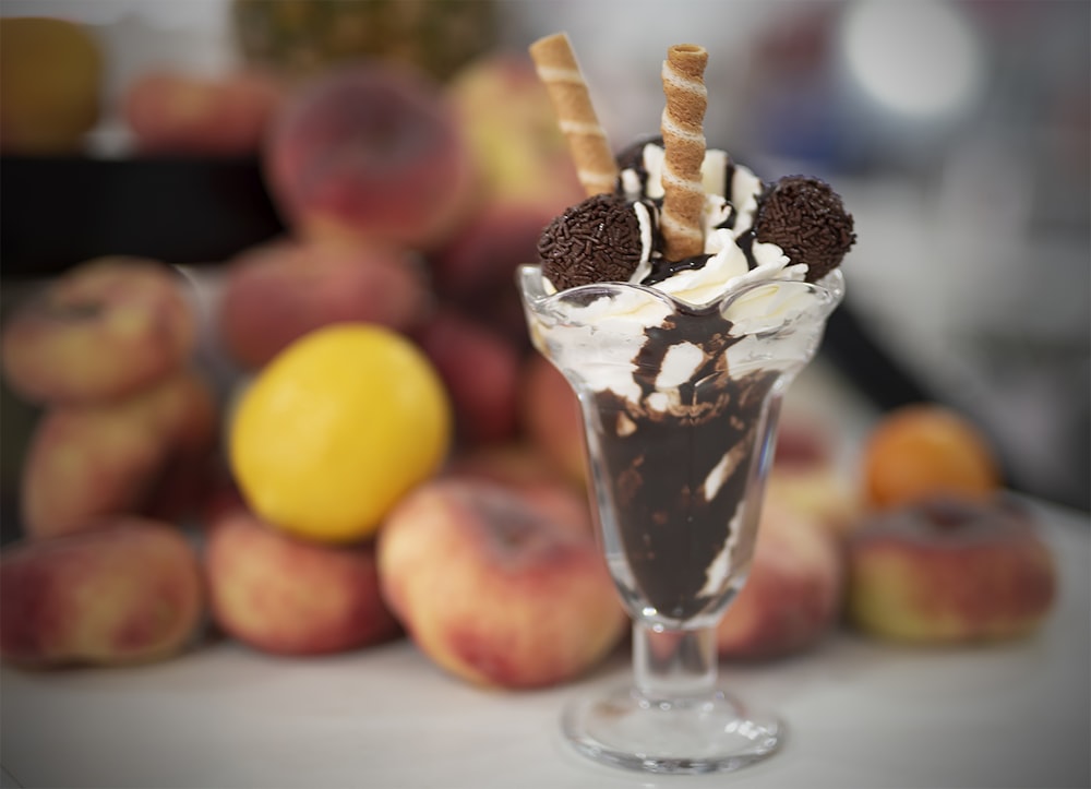 an ice cream sundae with chocolate and cookies on top