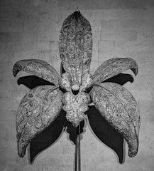 A giant opening flower showpiece unfolding with intricate detail.