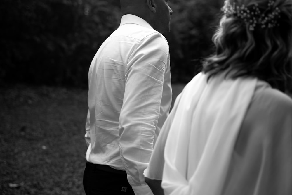 a man and a woman standing next to each other