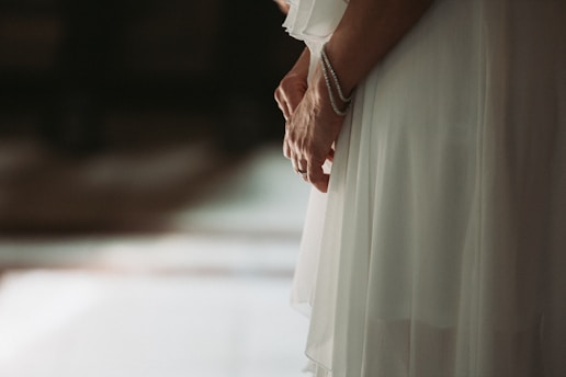 A serene morning scene with a woman wearing soft yoga clothes and delicate crystal bracelets, sunlight highlighting the sparkle of lab diamond jewelry.