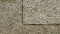 Close-up of waterproof OSB 3 material used in a sports locker.