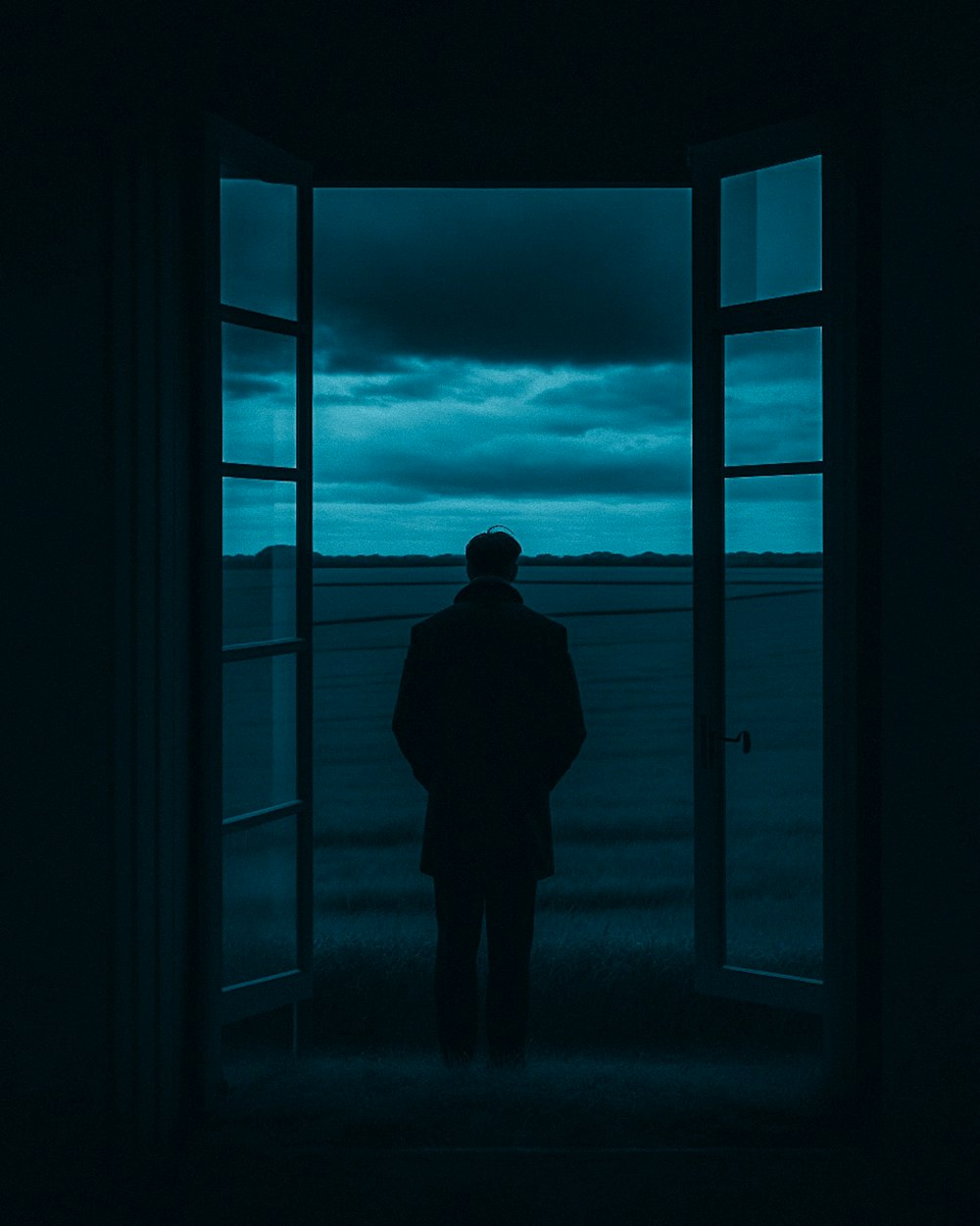 a man standing in front of an open door