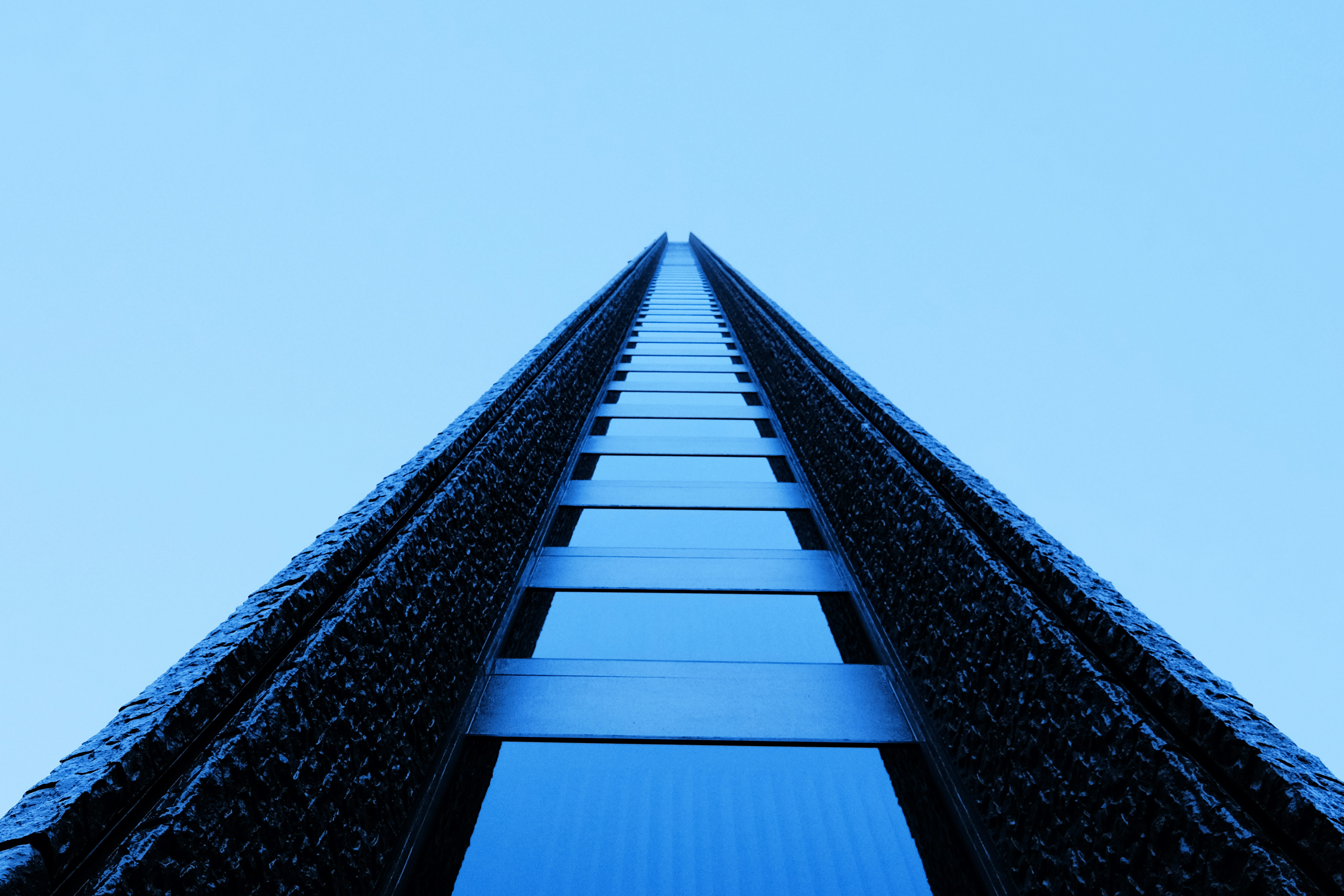 a tall building with a sky background