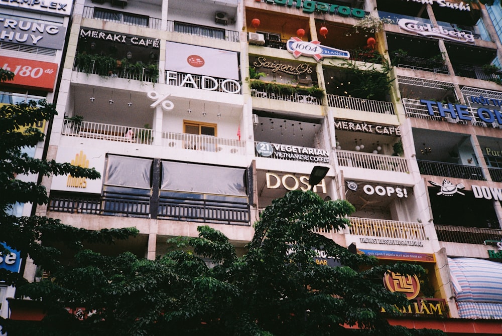 a tall building with lots of windows and balconies