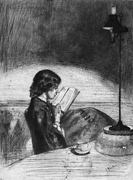 A focused young woman reading a book next to a steaming cup of coffee on a dimly lit table.