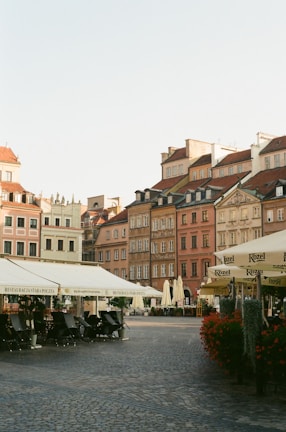 A charming European old town square with cobblestone streets and outdoor cafés.