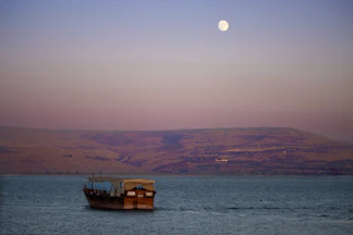 a boat floating on top of a large body of water