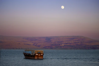 a boat floating on top of a large body of water
