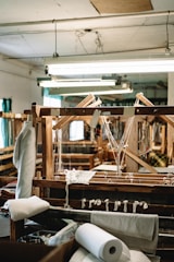 an old weaving machine is being worked on