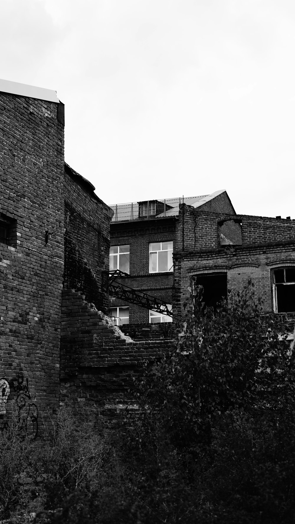 a black and white photo of a brick building