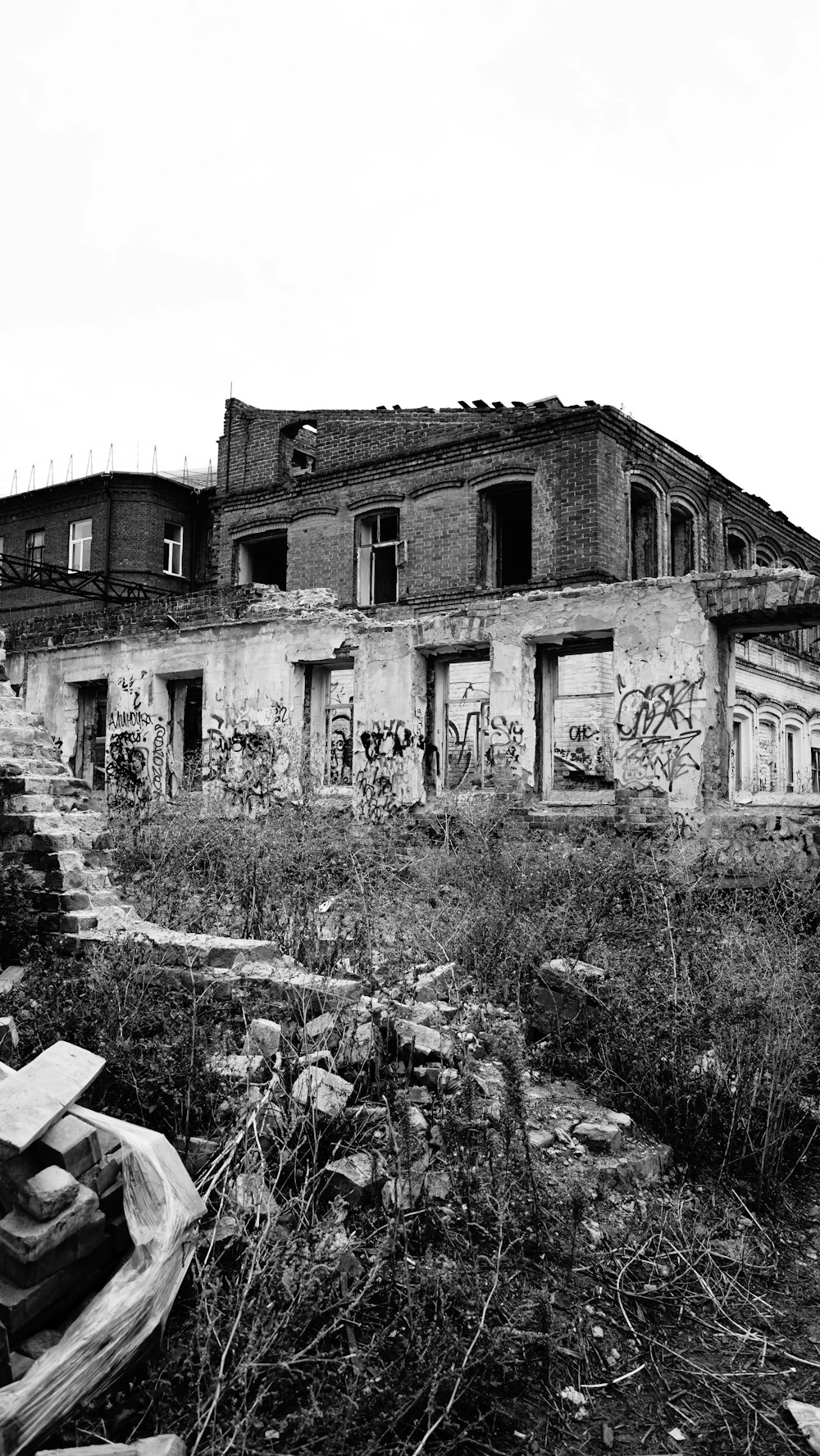 a black and white photo of a run down building