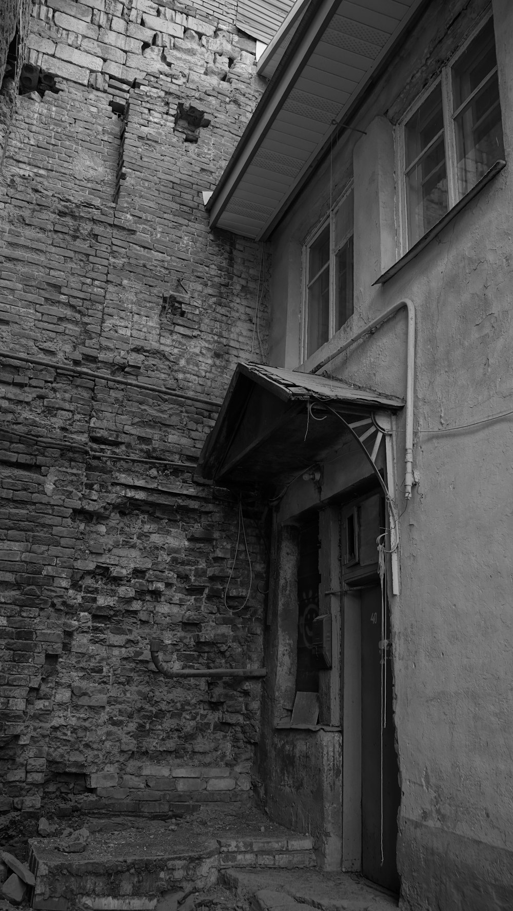 a black and white photo of a brick building