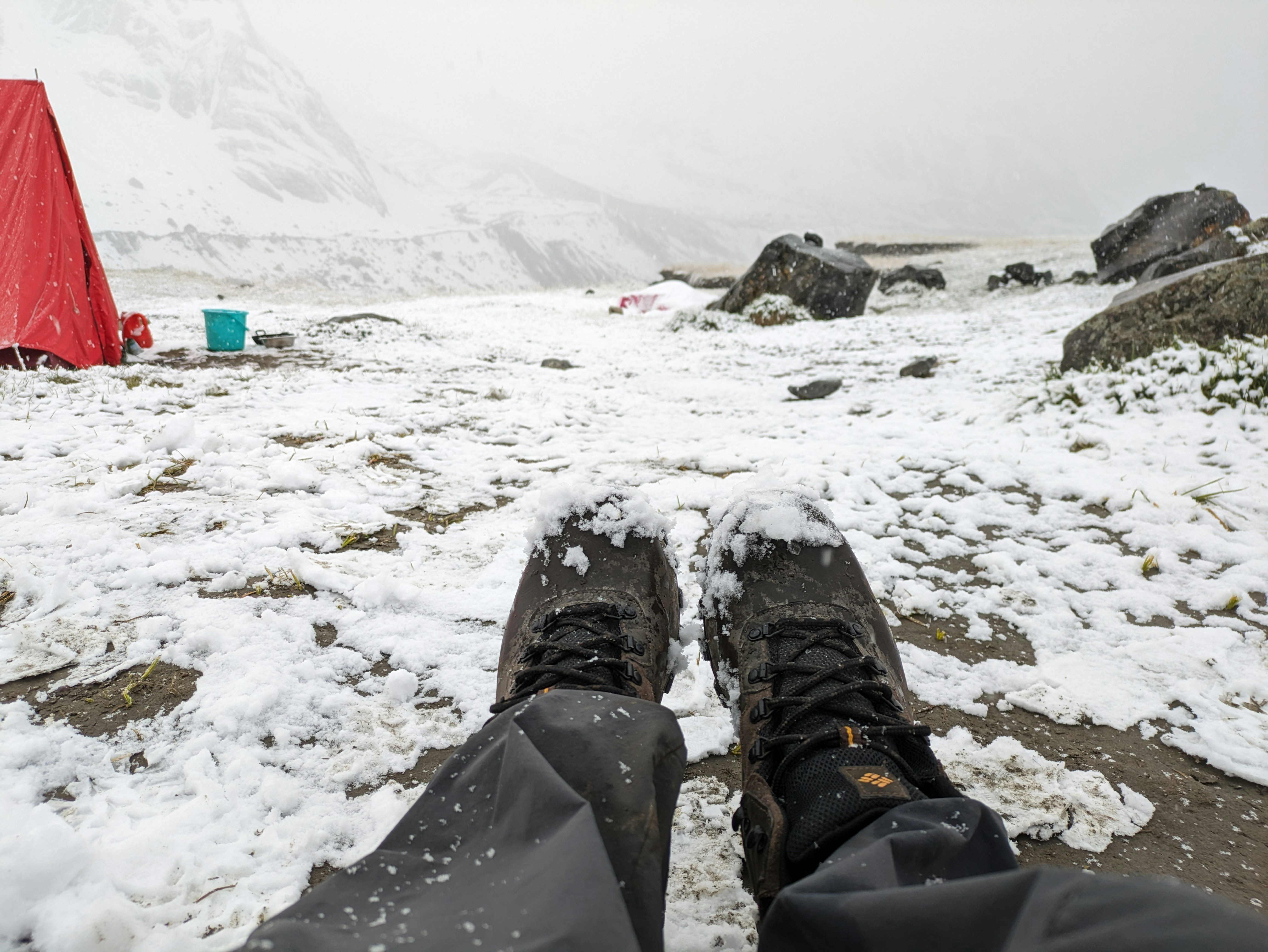 a pair of skis sitting on top of a snow covered ground