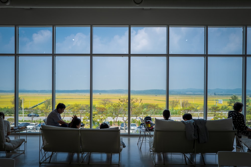 a group of people sitting around a living room