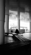 a person sitting on a bench in a building