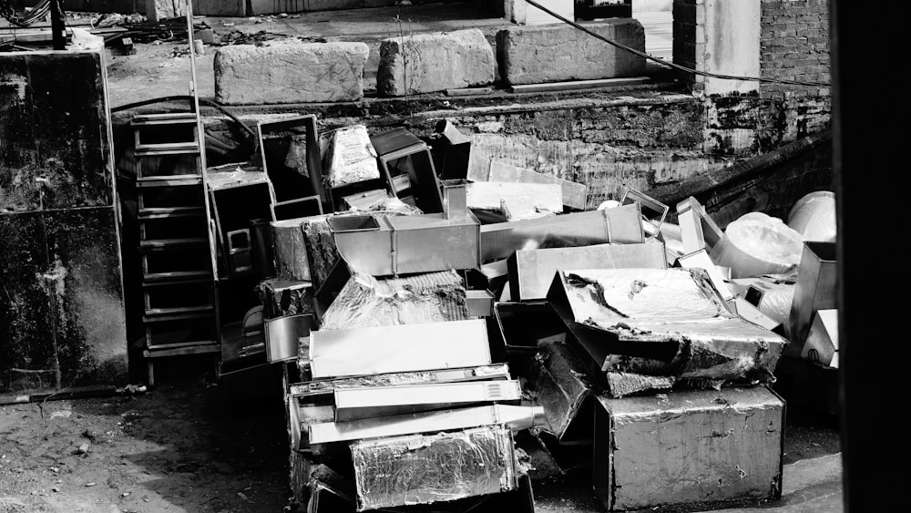 a black and white photo of a pile of junk