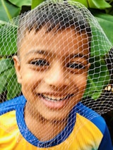 A satisfied customer enjoying their new pleated mosquito net.