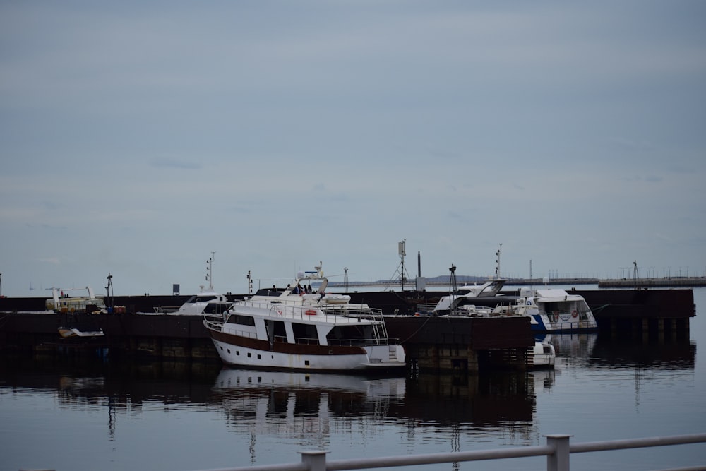 a boat docked at a dock with other boats