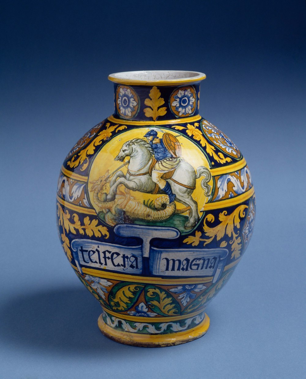 a vase with a horse painted on it