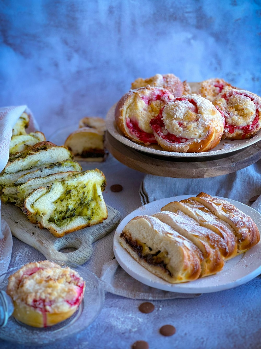 a table topped with pastries and desserts