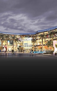 Contemporary retail center exterior with vibrant storefronts.