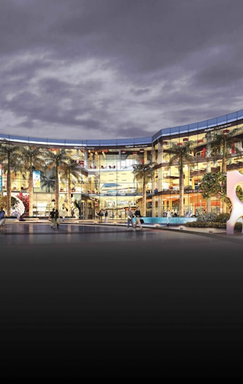 Modern shopping center exterior with people walking nearby