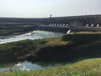 A hydroelectric dam surrounded by lush greenery.