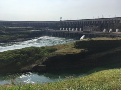 A hydroelectric dam surrounded by lush greenery.
