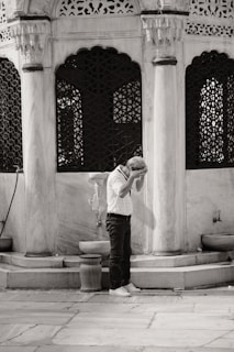 a man is standing in front of a building