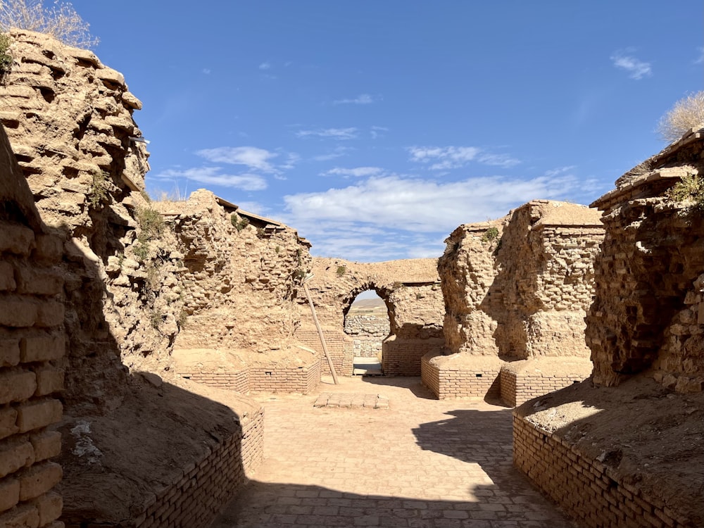 a stone building with a doorway in the middle of it